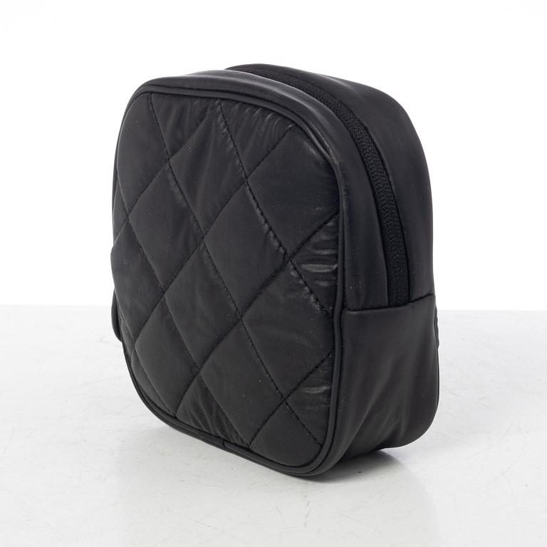 Chanel, tennis racket and 4 balls with case.