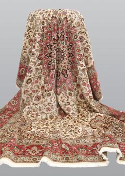 A carpet, Tabriz part silk, so called 50 Raj, cm 400 x 300 cm.