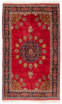 An oriental rug, c. 245 x 150 cm.