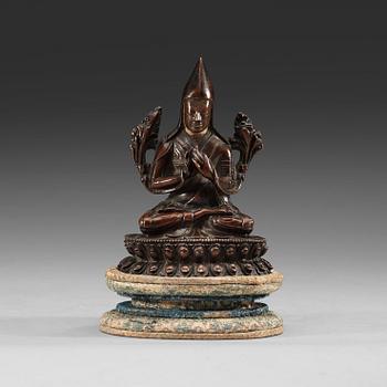 86. A copper alloy seated figure of a Tsong Khapa, presumably Nepal, 19th Century or older.