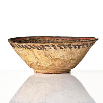 A conic pottery bowl, probably Nishapur, Northeast Persia, 10th century.