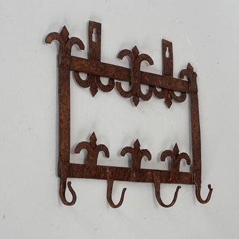 An 18th century iron wall hanger.