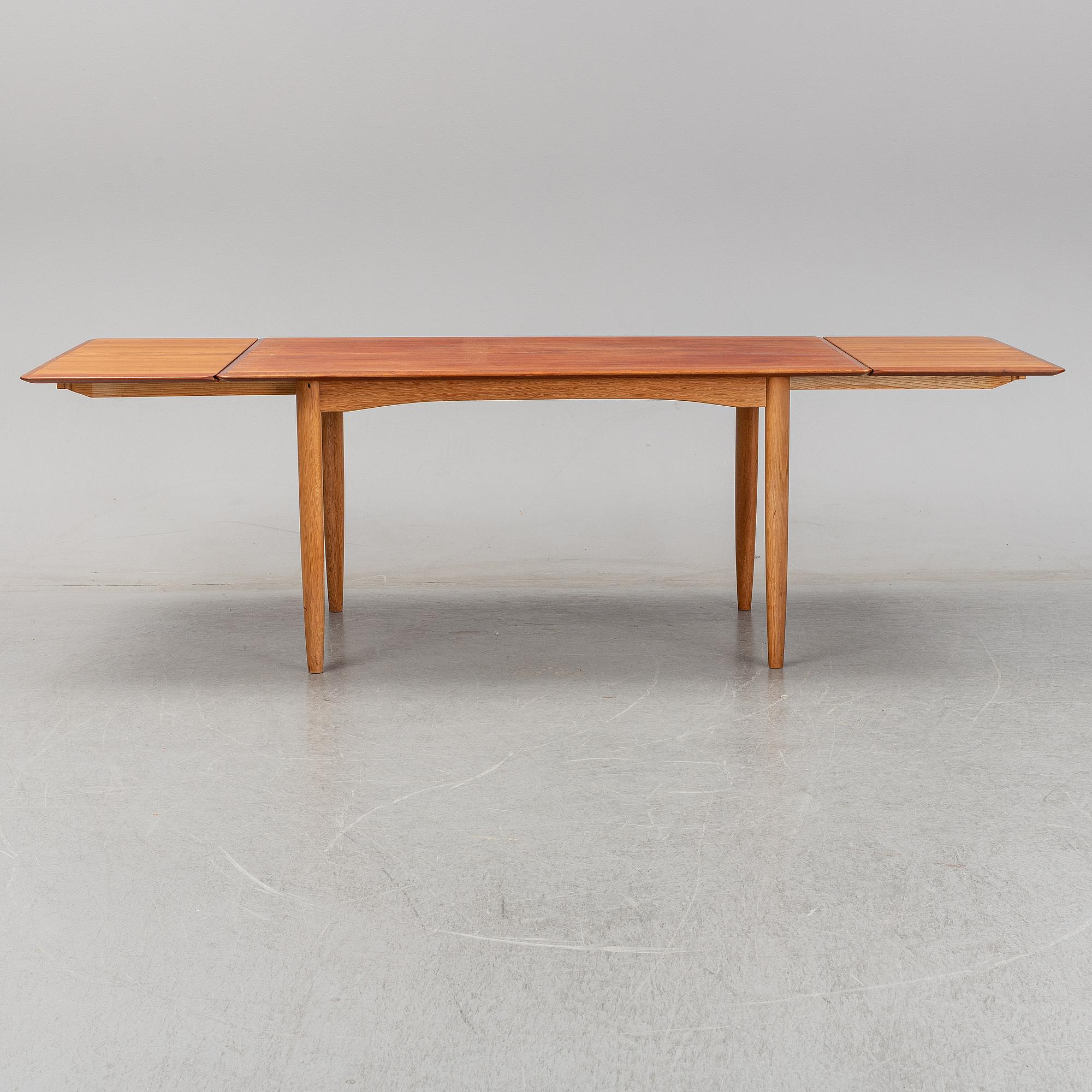 A 1950/60's dining table from Slagelse Møbelvaerk A/S with two additional leaves.