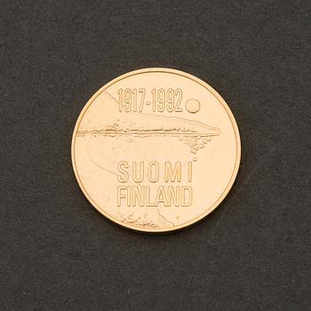 A Finnish gold .900 commemorative coin, 1000 mk, Finland 75 years.