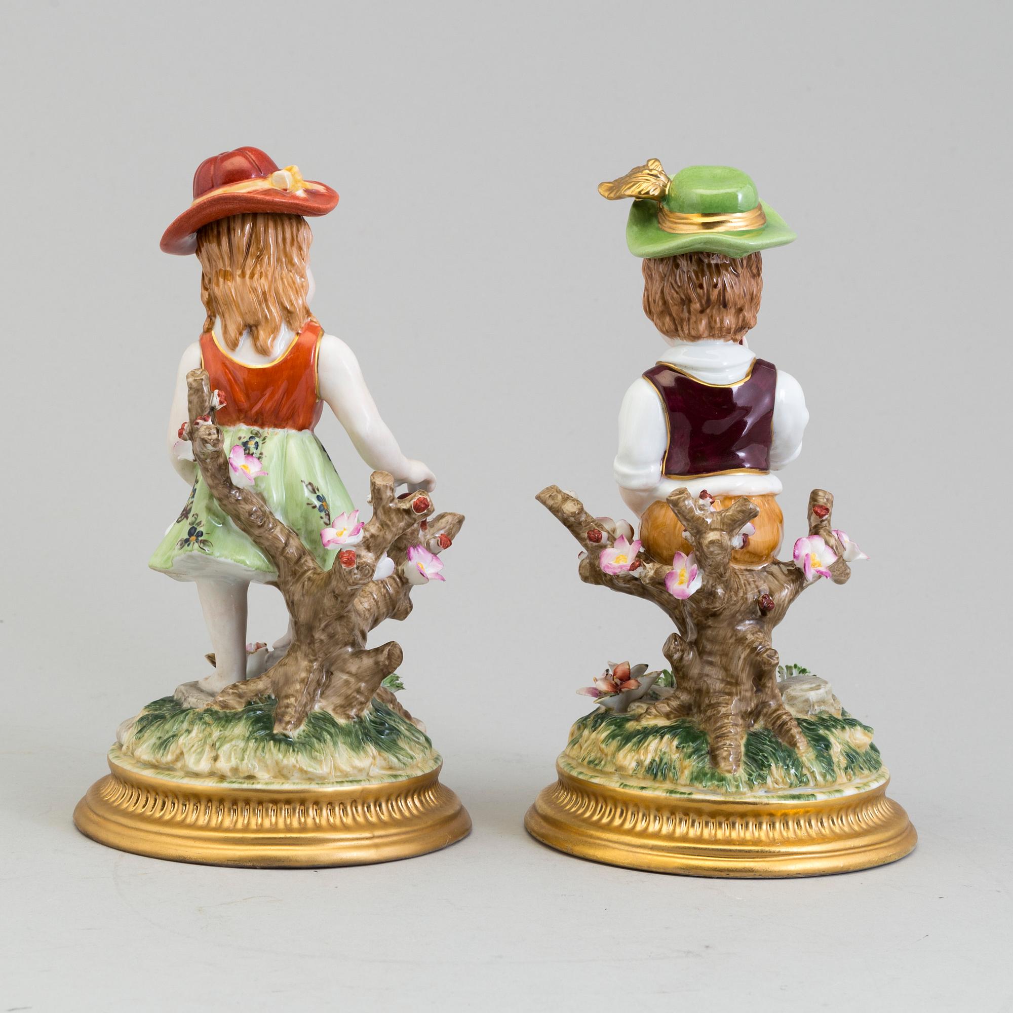 a pair of porcelain figurines marked similar to meissen, 20th century.