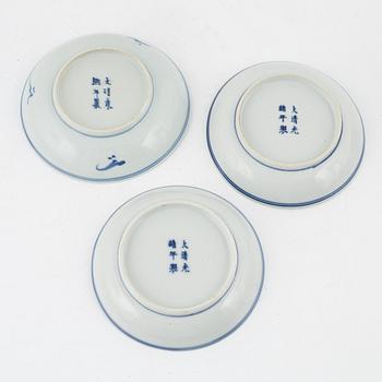 a pair of blue and white cups and three dishes, China, late Qing dynasty.