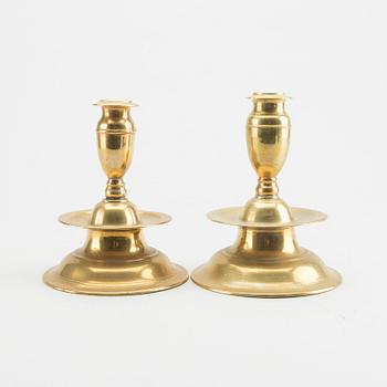 A set of two late Baroque brass candelsticks.