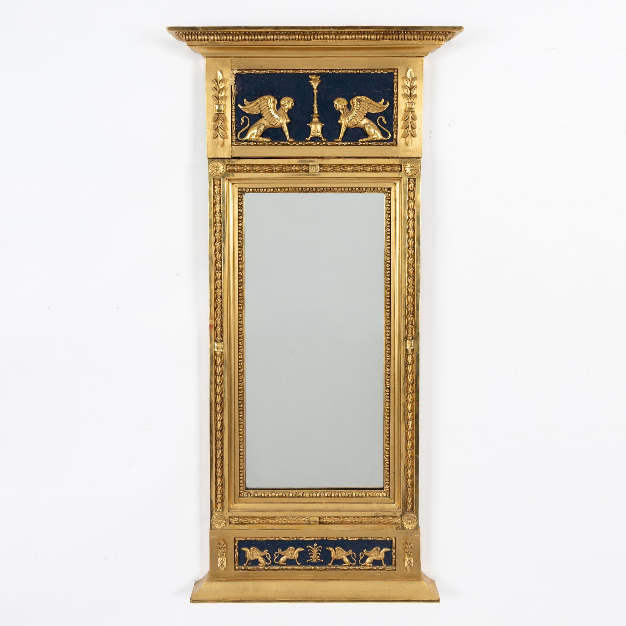 An Empire mirror, first half of the 19th Century.