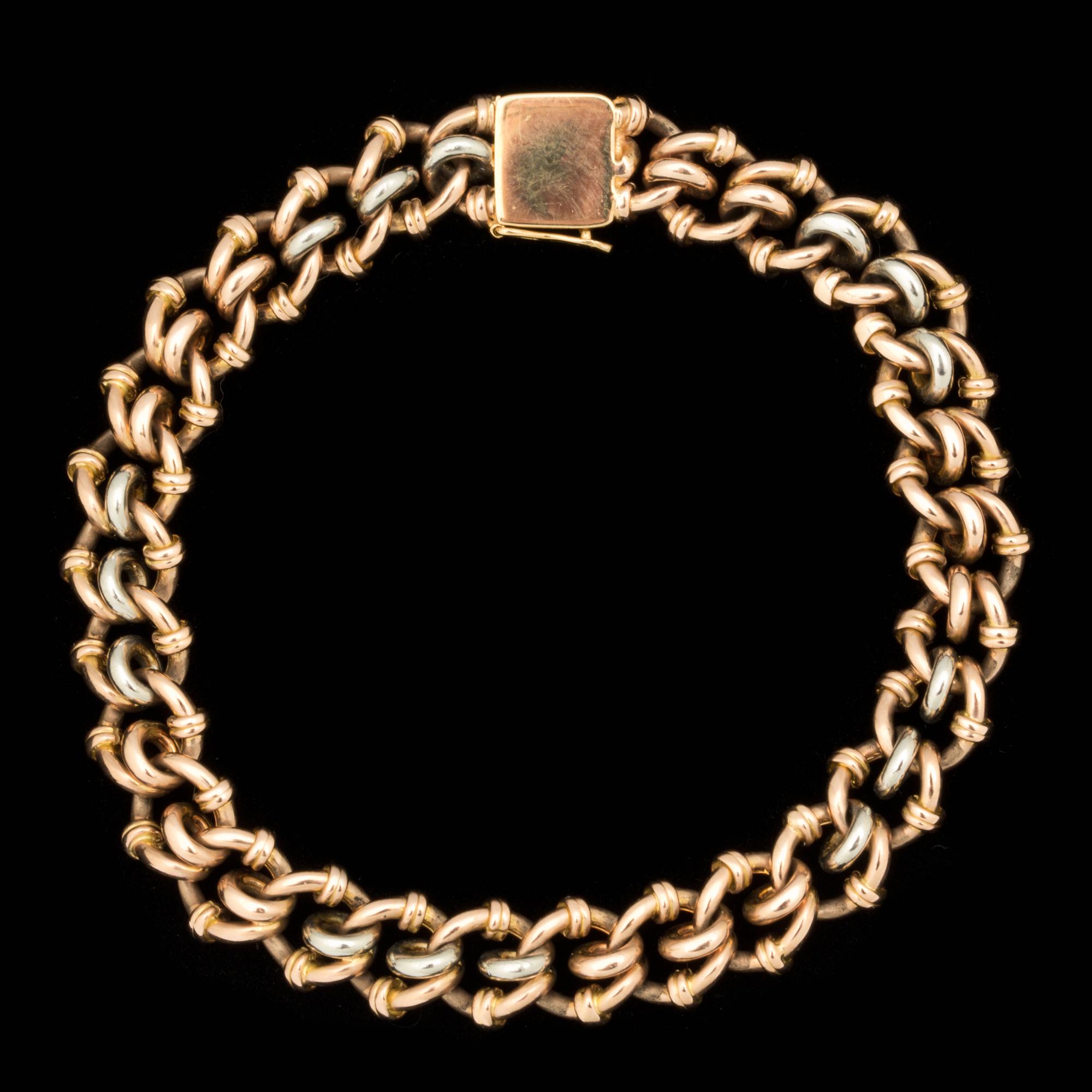 ARMLÄNK, 18 k vit och rött guld. Vikt ca 32 g.