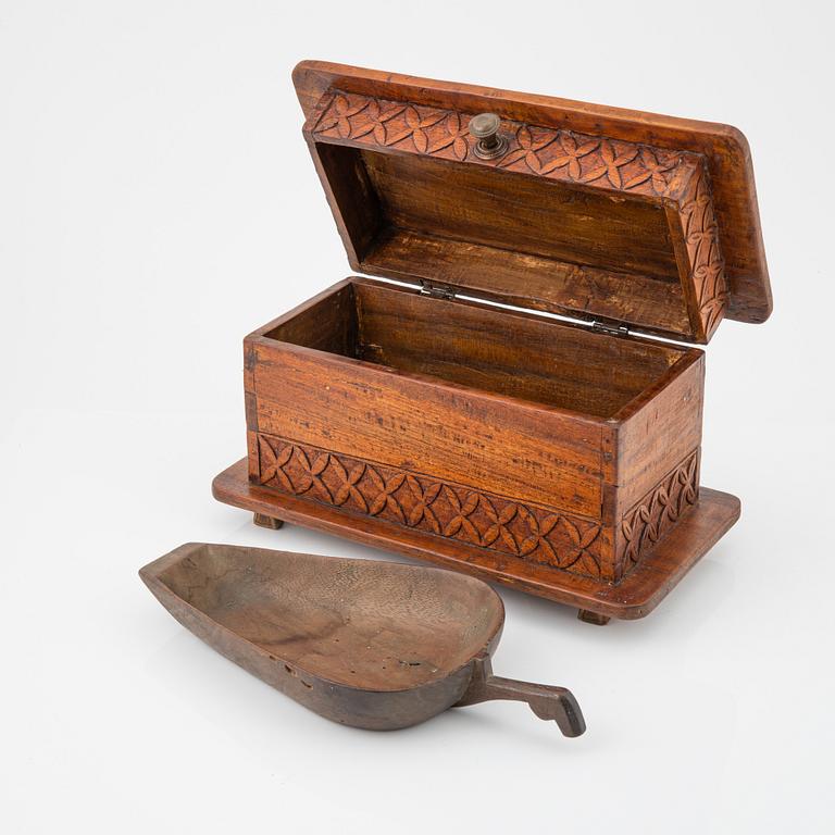 A carved wooden box, a ladle and three placques, Jakarta, Indonesia, 20th Century.