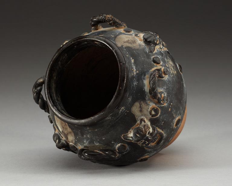 A black glazed jar, Tang dynasty (618-907).