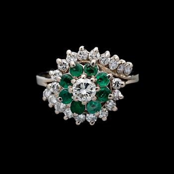 A RING, brilliant cut diamonds, emeralds, 18K white gold. Birmingham.