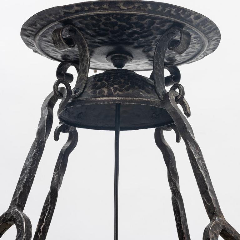 A Swedish Art Nouveau ceramic and iron ceiling light, Höganäs, early 20th century.