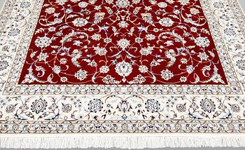 A Nain part silk carpet, 302 x 204 cm.