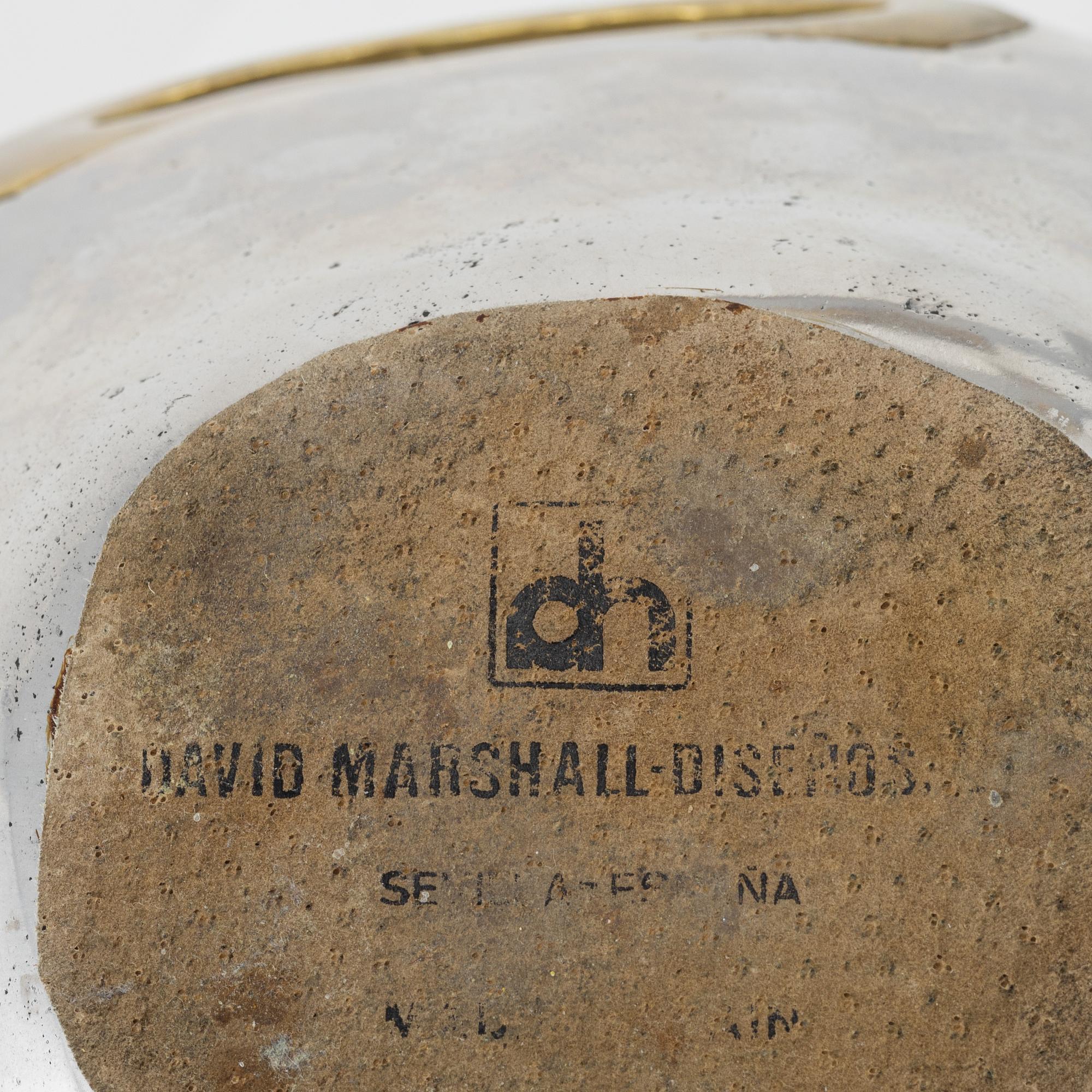 David Marshall, a metall and brass bowl and a pair of candle sticks.