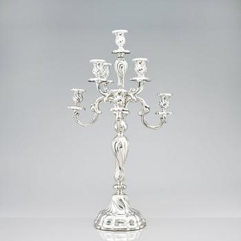 A pair of eight-light Louis XV-style silver candelabra, mark of Hermann Julius Wilm, Berlin, circa 1900.