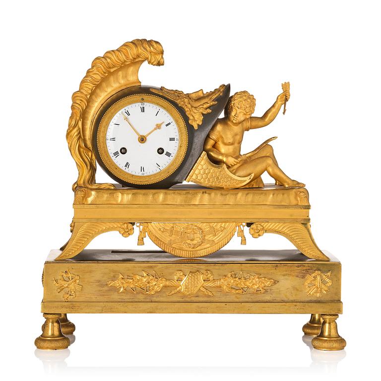 A French Empire sculptural ormolu and patinated bronze mantel clock, early 19th century.