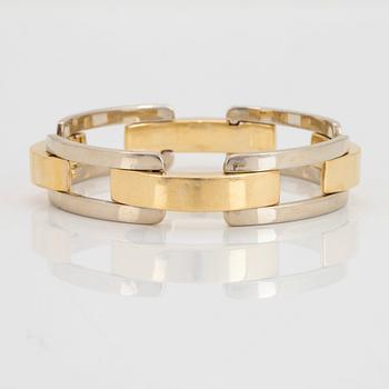 An 18K gold and white gold Cartier bracelet.