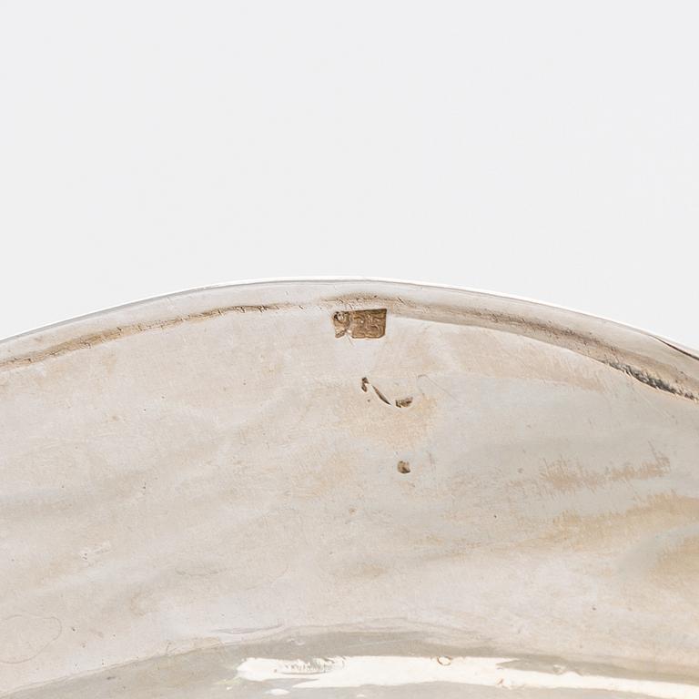 A 12-piece set of sterling silver dishes / coasters, Peru 1950s-60s.