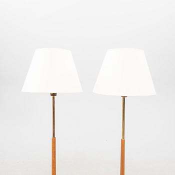 A pair of 1960s teak floor lamps.
