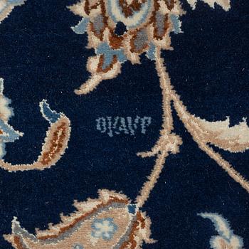 A Nain carpet, signed, c. 315 x 200 cm.