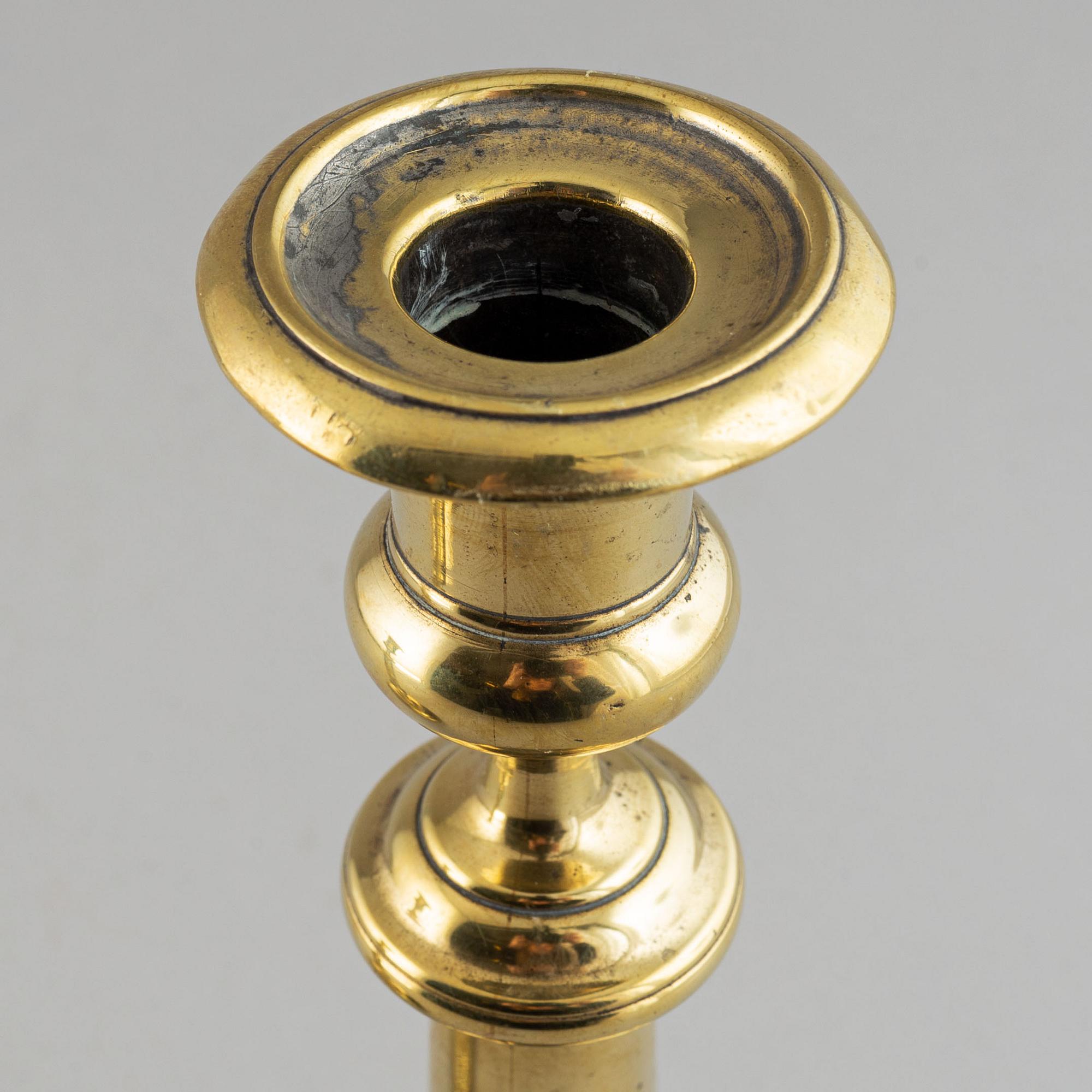 A pair of bronze Rmpire candlesticks, first half of he 19th century.