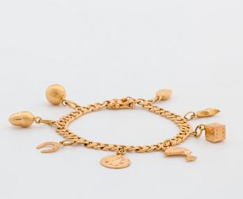 BRACELET 18K GOLD WITH 8 CHARMS.