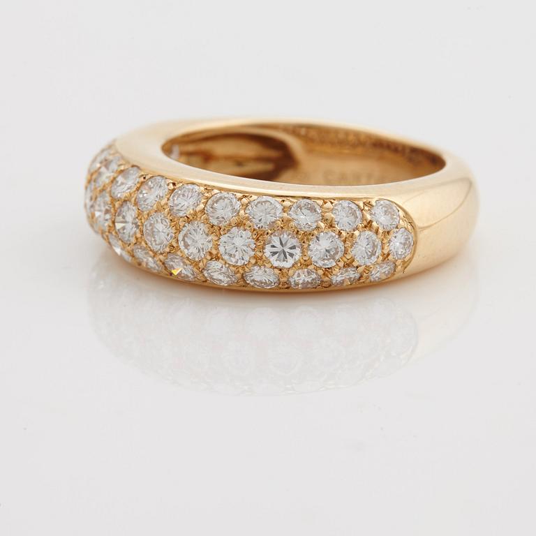 A brilliant cut diamond ring by Cartier.