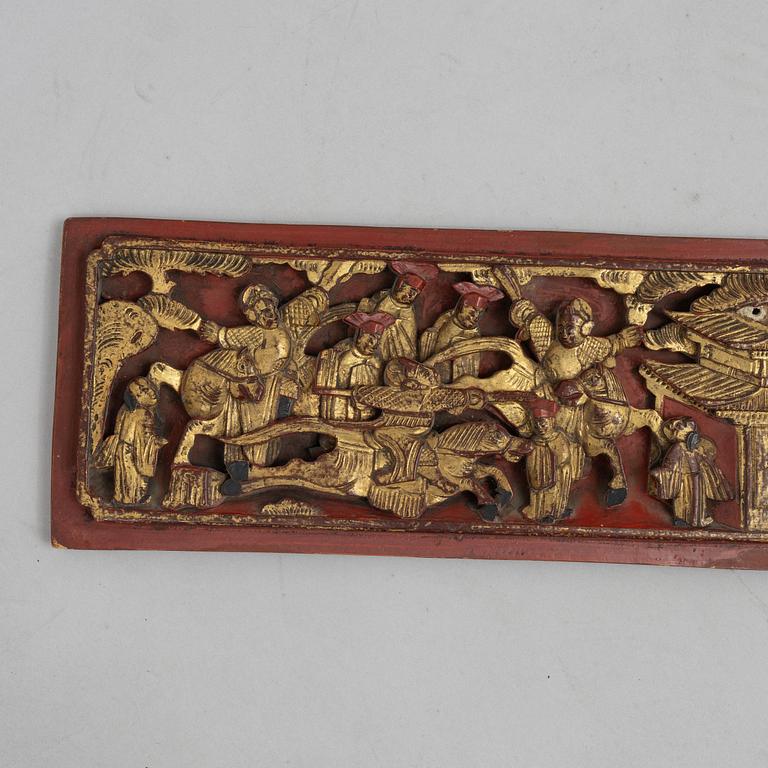 A group of three Chinese wooden panels, late Qing dynasty / around 1900.