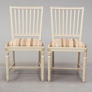 A dining table and 4 chairs, second half of the 20th century. 2 leaves included.