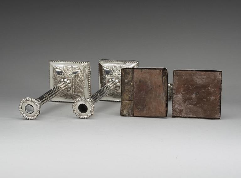 A set of four English silver candlesticks, marks of William Holmes, London 1772.