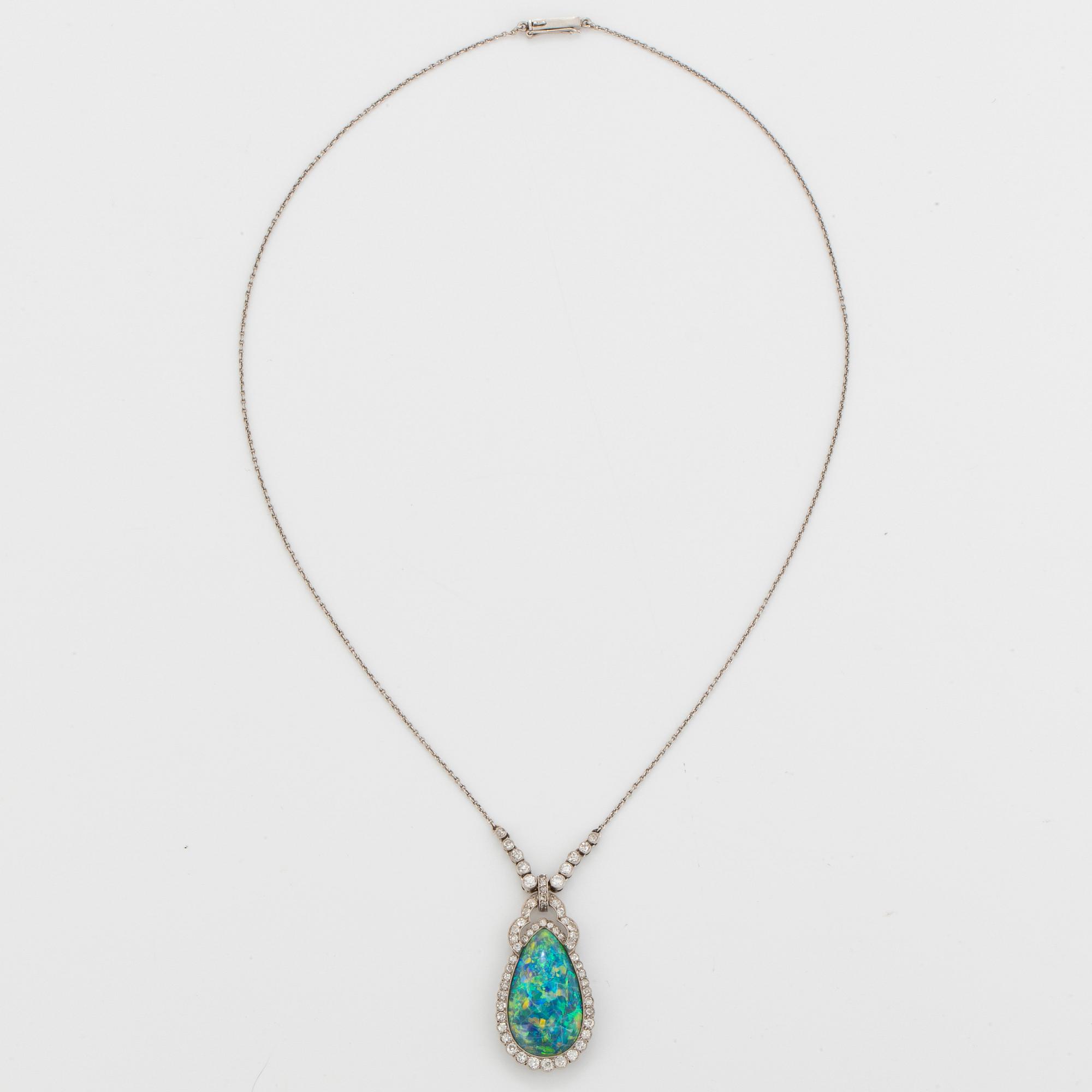 A platinum and black opal necklace set with old- and eight-cut diamonds.