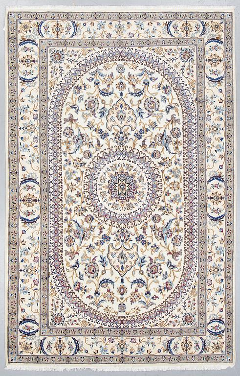 A carpet, Nain, part silk, ca 296 x 192 cm.