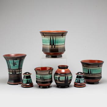 MAGGI WIBOM, a set of 7 faience vases, flower pots, candle holders, Bo Fajans, Sweden, 1920-30s.