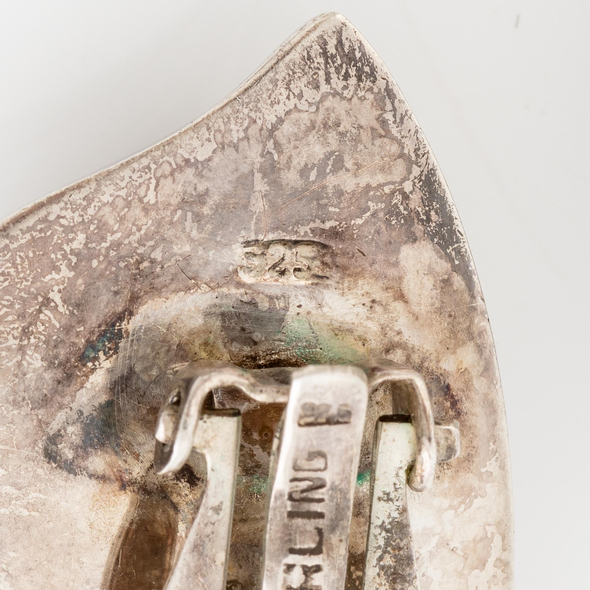 Earrings, silver, in the form of stylised leaves.