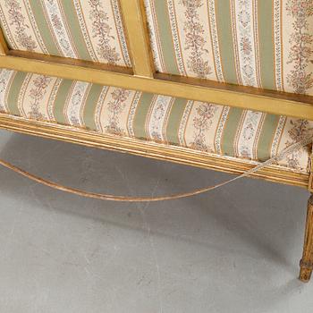 A Louis XVI style sofa from the first half of the 20th century.