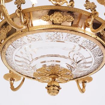 An Empire cut glass and gilded bronze six-light hanging lamp in the manner of Alexandre Guérin.
