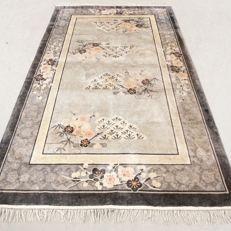A Chinese old silk carpet ca 240x153 cm.