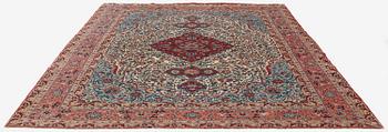 A semi-antique Qum carpet. Central Persia, c. 345 x 258 cm.