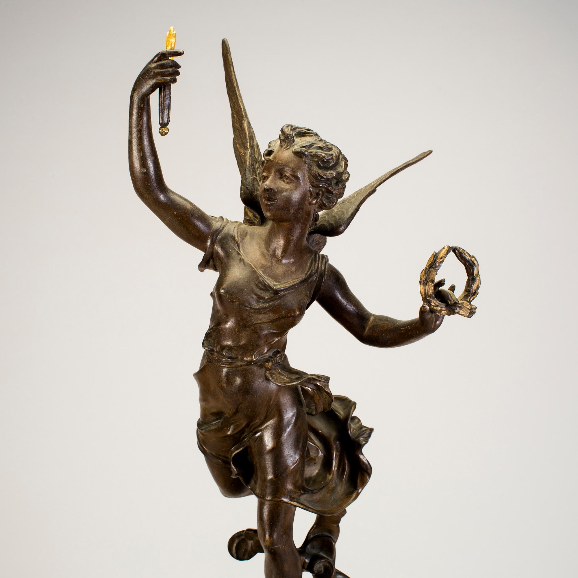 A mantel clock with sculpture "L'occident" after Émile Bruchon from the turn of the century 1800/1900.