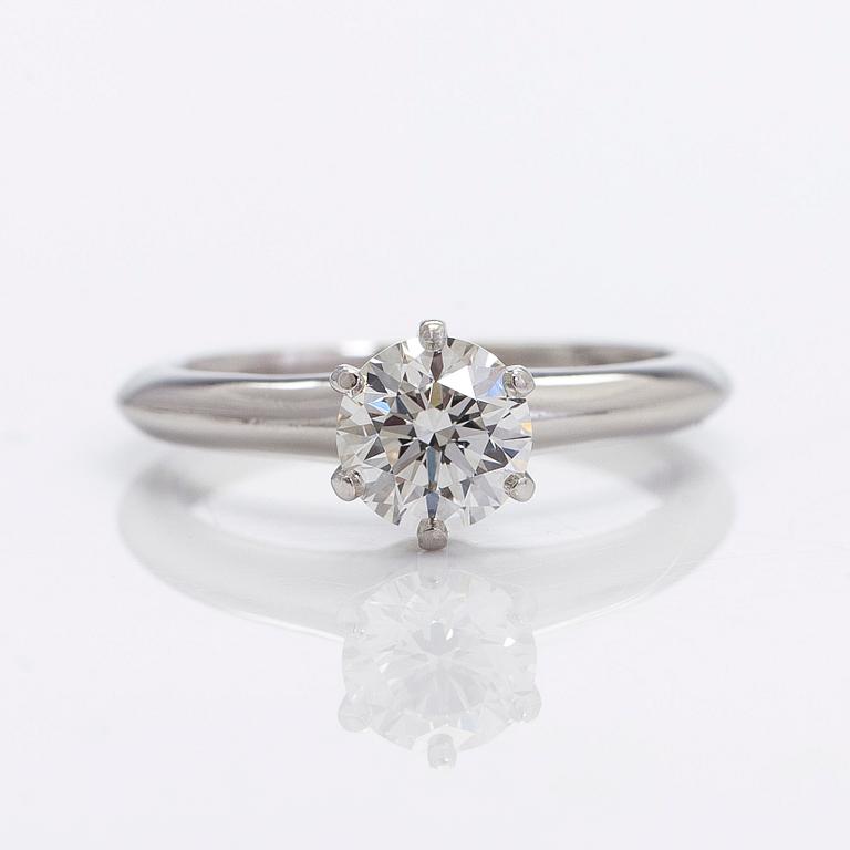 Tiffany & Co, a platinu solitaire ring with a brilliant-cut diamond.