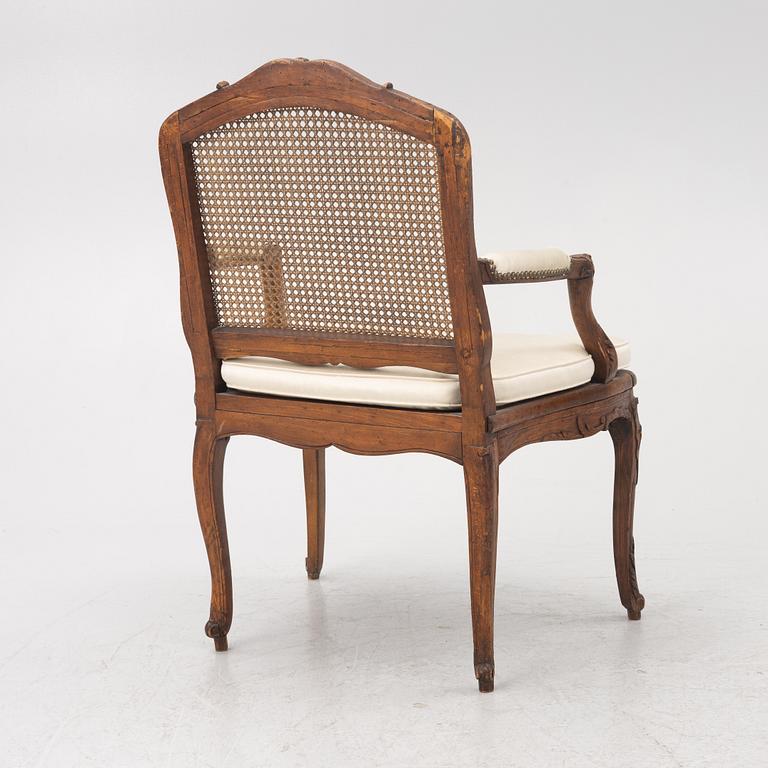 A French Louis XV armchair, mid 18th century.