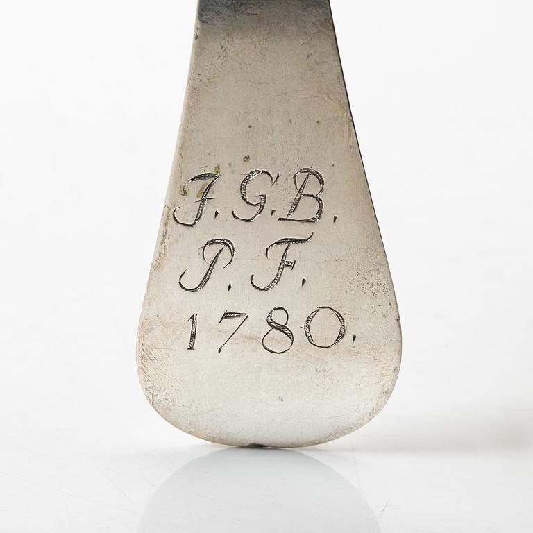 Two silver serving spoons with pseudo-marks, around the year 1900.