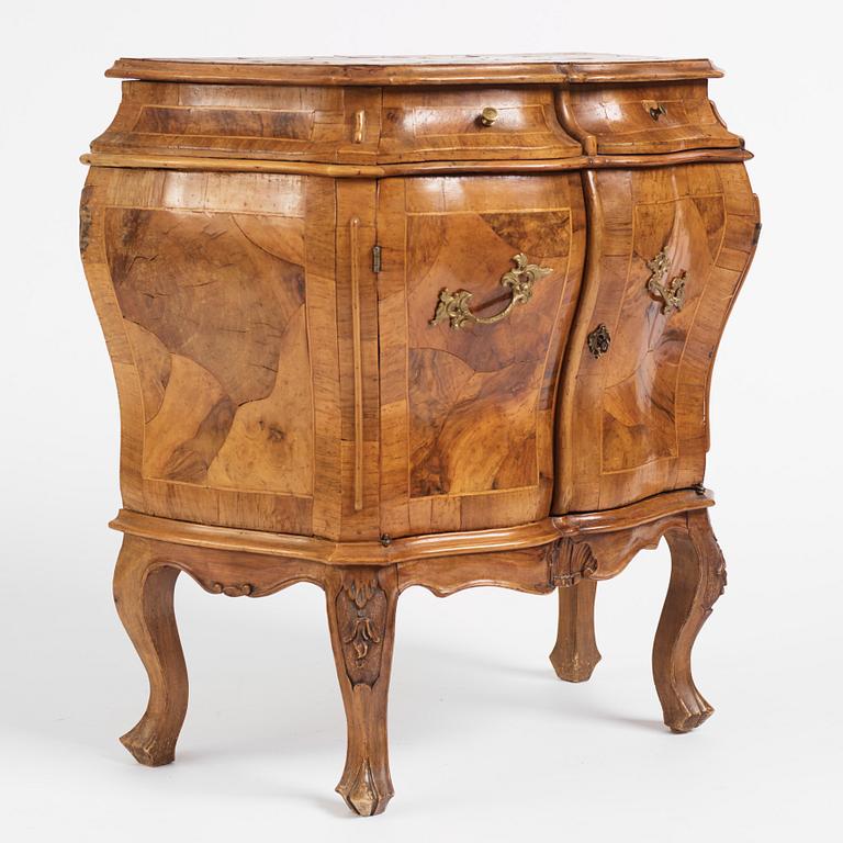 An Italian Louis XV-style bombé commode, 20th century.