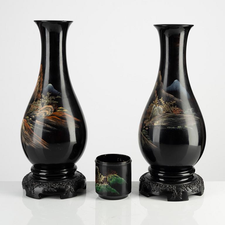 A pair of Japan lacquered vases and a brushpot/bottom for a box, around 1900.