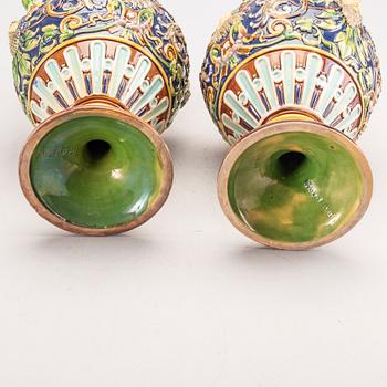 A pair of majolica urns around 1900.