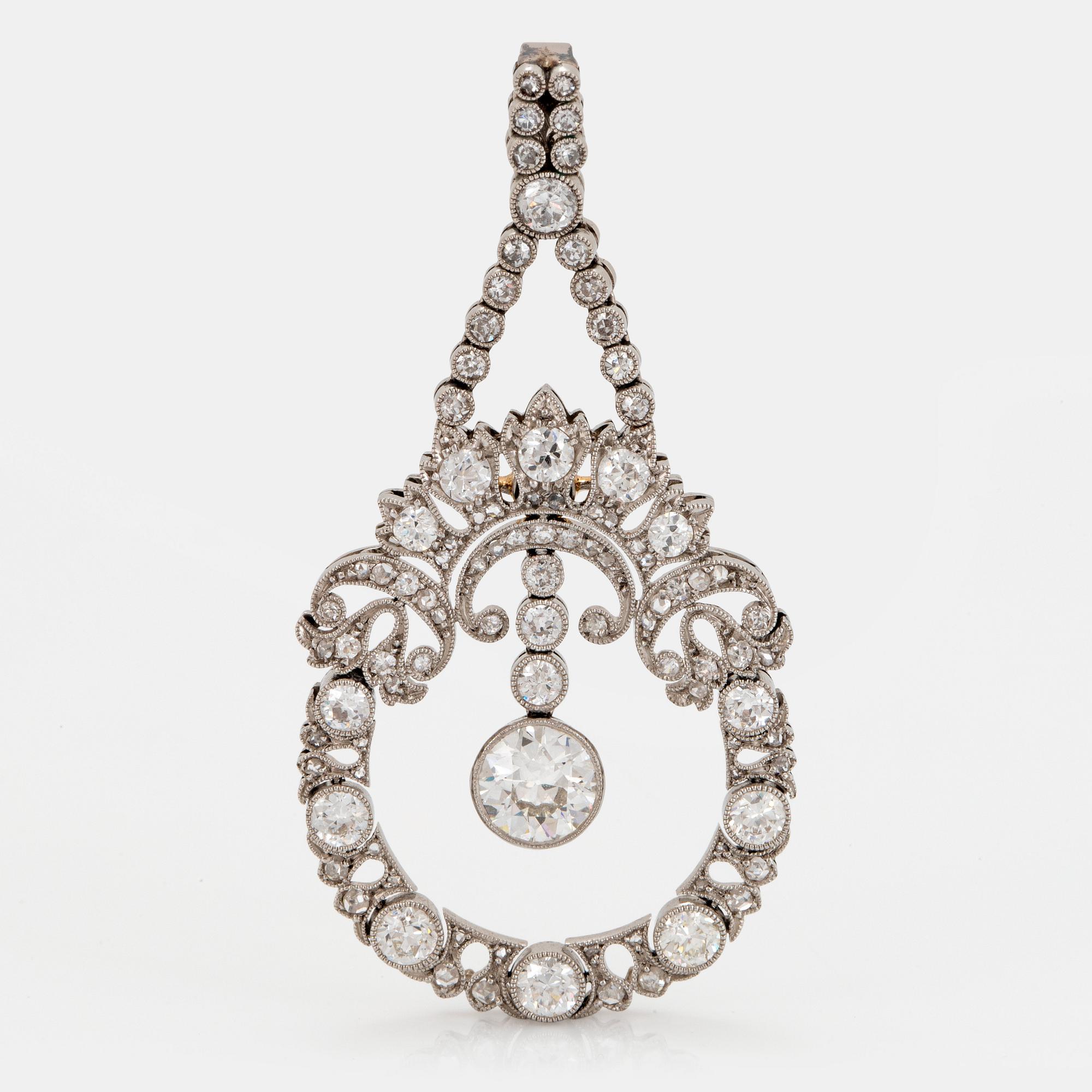 A platinum pendant set with old-, eight and rose-cut diamonds.