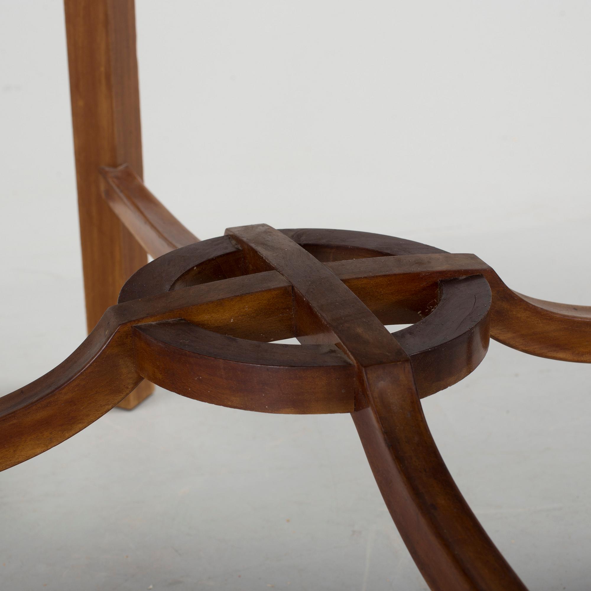 A mid 20th century mahogany veneered table from Nordiska Kompaniet (NK).