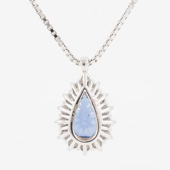 Pendant with 18K gold chain featuring a faceted sapphire and round brilliant-cut diamonds.