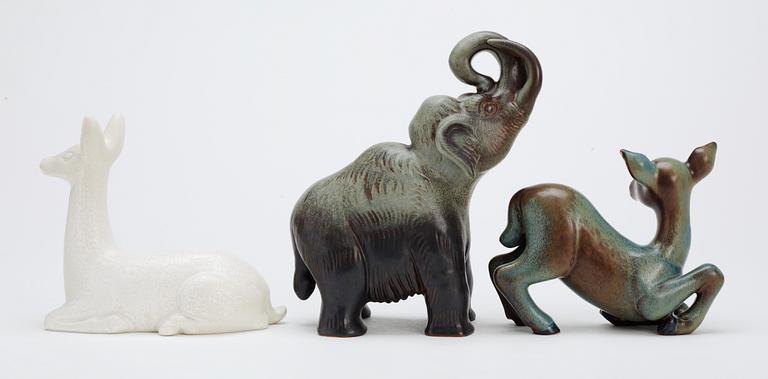 Three Gunnar Nylund stoneware figures, two deer and a mammoth, Rörstrand.